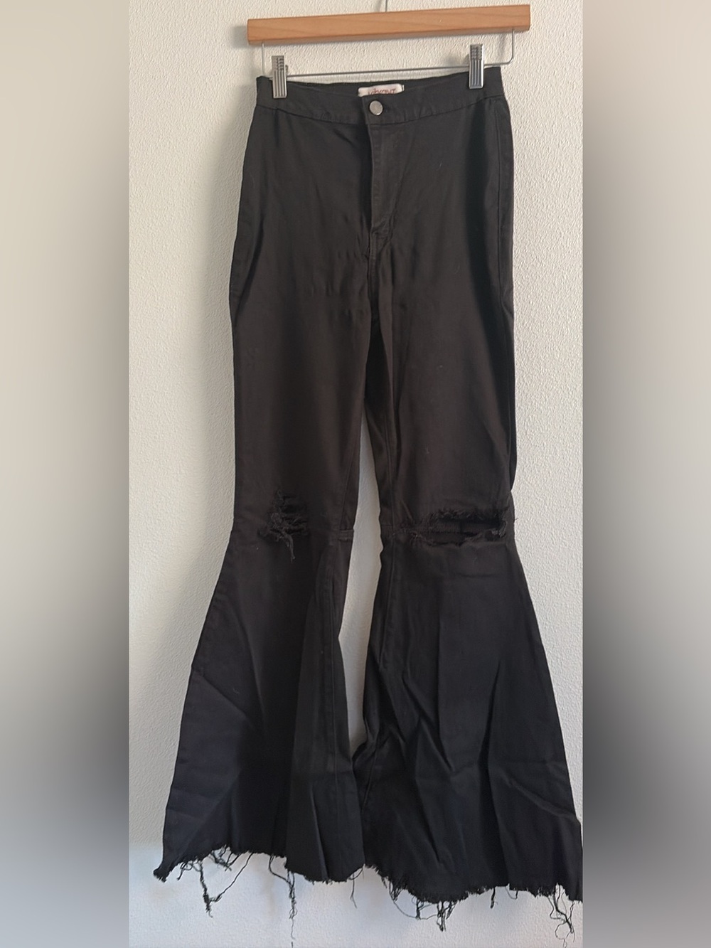 Distressed black flare legged pants